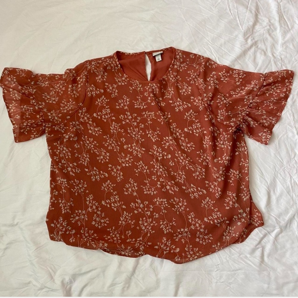 Plus size pink blouse with floral print